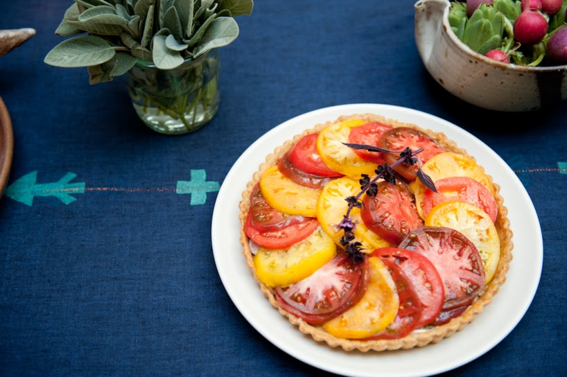 Heirloom tomato tart on a blue tablecloth