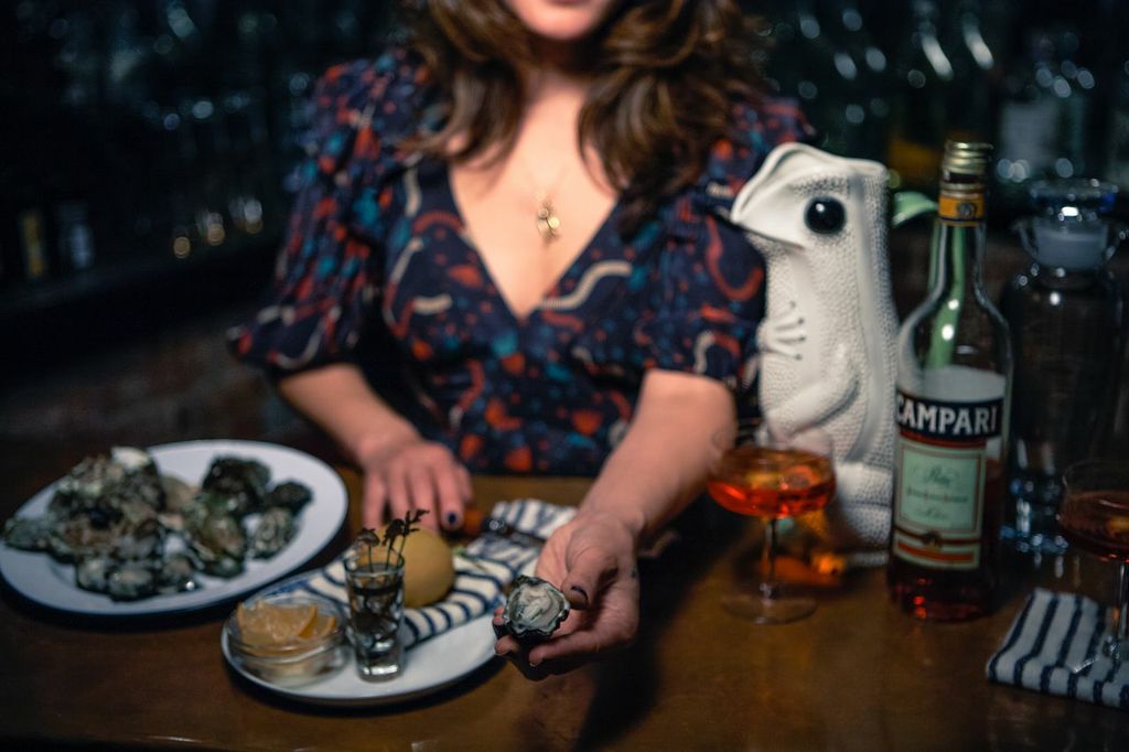 Oysters served at a candlelit bar