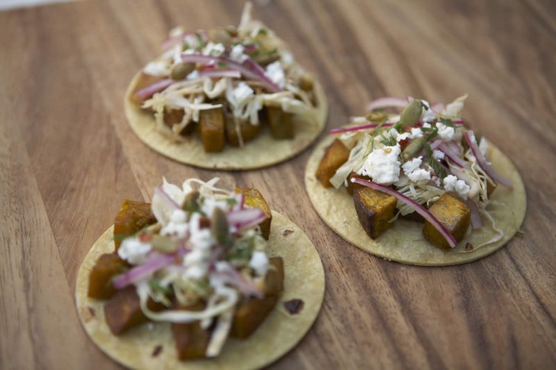 Pumpkin tacos with slaw and crumbled feta