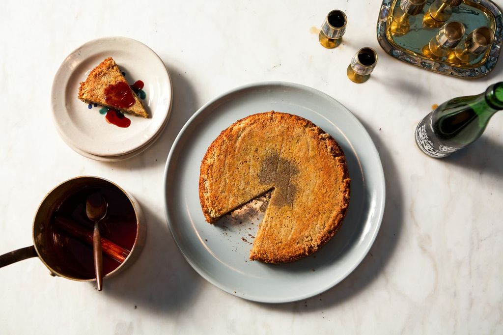 An almond cake, sliced, with tea