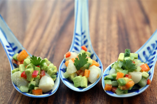 Diced vegetable salad served in porcelain spoons