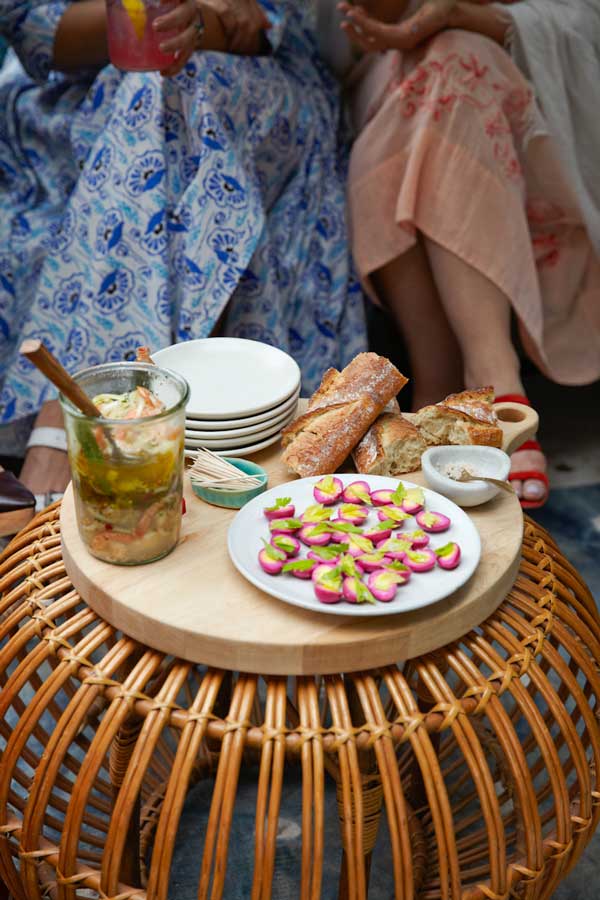 Pickled eggs, bread and a jar of pickles at a garden party