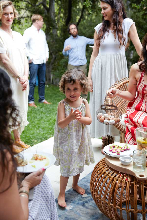 A young guest at a garden party