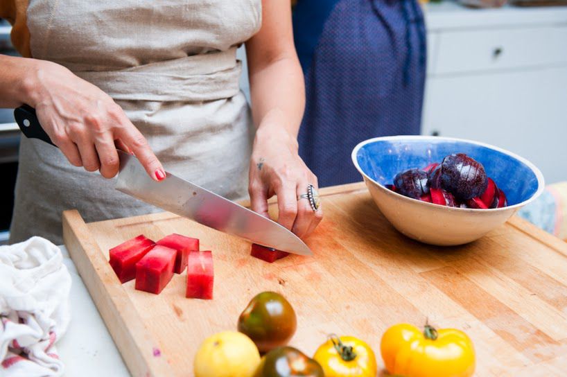 Slicing heirloom tomatoes on a cutting board