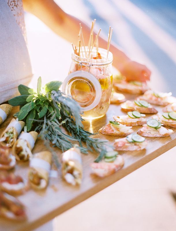Crostini on a tray with fresh herbs