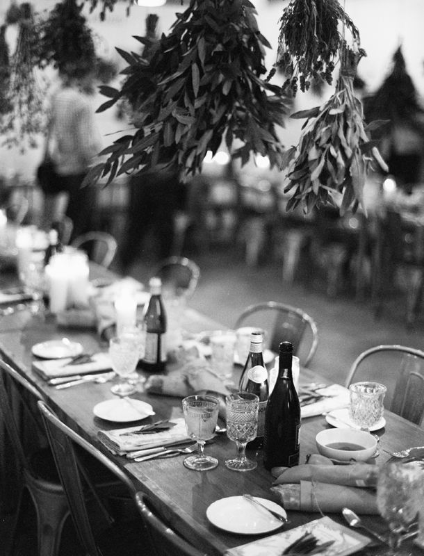 A candlelit dinner table in black and white