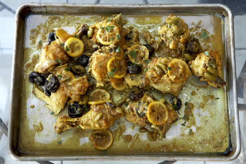 Moroccan chicken with preserved lemons and olives in a roasting pan